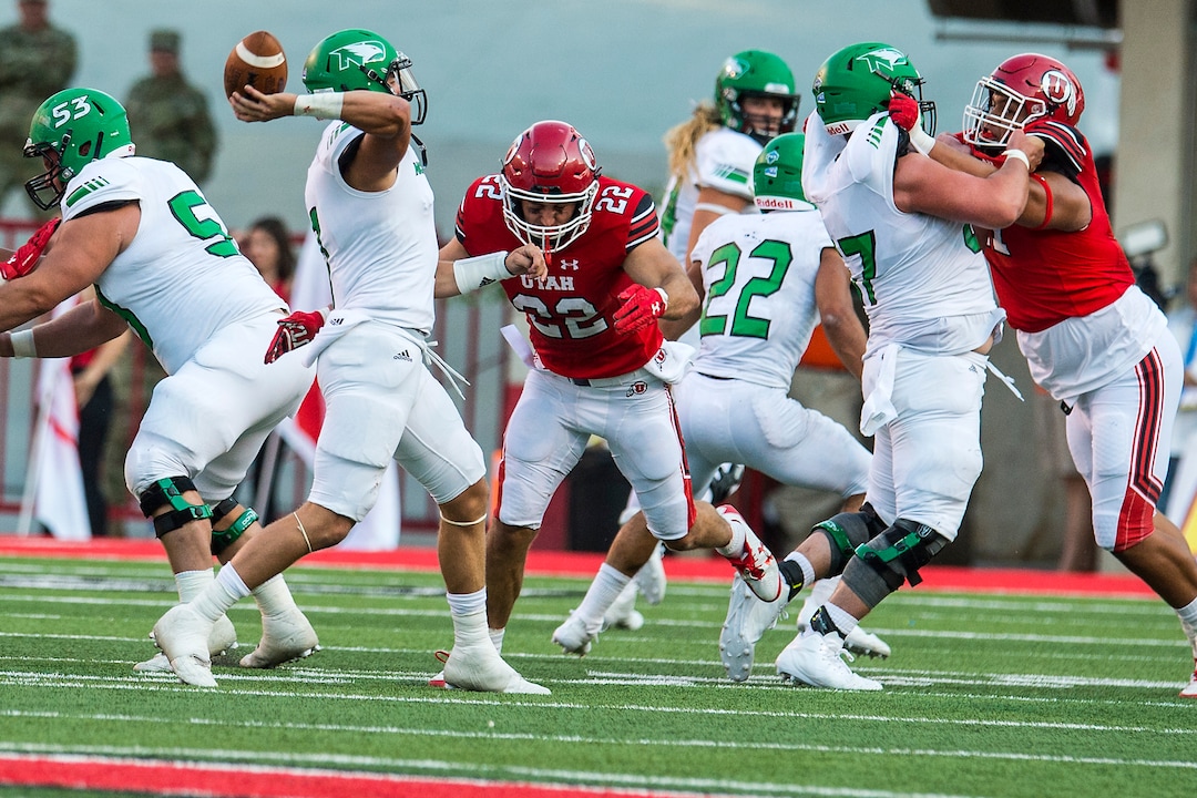 (Chris Detrick  |  The Salt Lake Tribune)  Utah Utes defensive back Chase Hansen (22) puts pressure on North Dakota Fighting Hawks quarterback Keaton Studsrud (7) during the game at Rice-Eccles Stadium Thursday, August 31, 2017. Utah Utes are leading North Dakota Fighting Hawks 17-9 at halftime. 