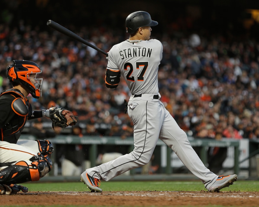 (AP Photo/Ben Margot) Miami Marlins' Giancarlo Stanton swings for a double off San Francisco Giants' Jeff Samardzija in the fifth inning of a baseball game Saturday, July 8, 2017, in San Francisco.