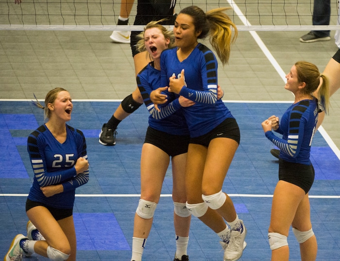 (Rick Egan  |  The Salt Lake Tribune)  The Pleasant Grove Vikings celebrate as they win the first set, in the 6A volleyball championship action, Pleasant Grove vs. Lone Peak, at Utah Valley University, Saturday, November 4, 2017.