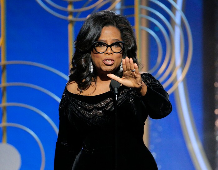 This image released by NBC shows Oprah Winfrey accepting the Cecil B. DeMille Award at the 75th Annual Golden Globe Awards in Beverly Hills, Calif., on Sunday, Jan. 7, 2018. (Paul Drinkwater/NBC via AP)