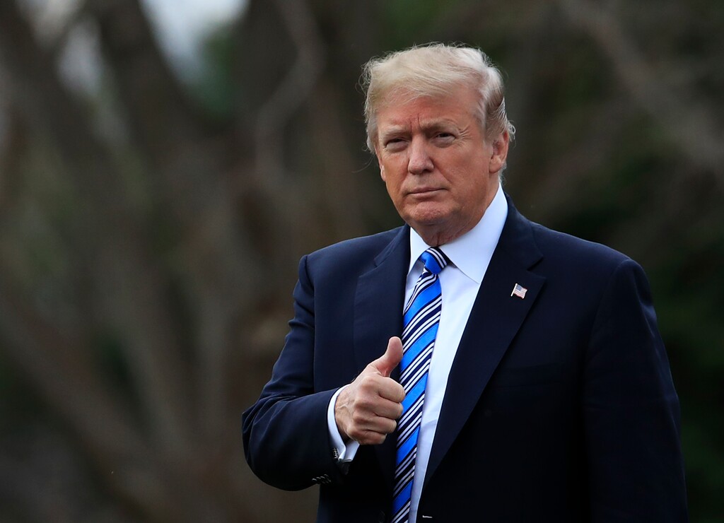President Donald Trump gestures as he walks as he leaves the White House, Friday, Feb. 16, 2018, in Washington, for a trip to his private Mar-a-Lago resort in Florida. (AP Photo/Manuel Balce Ceneta)