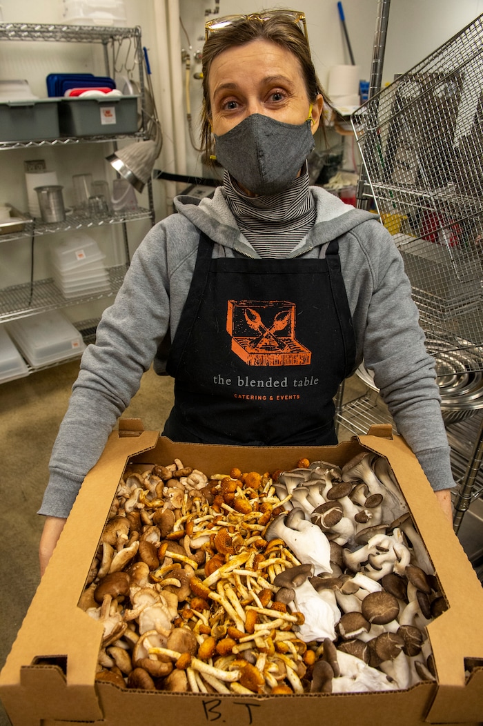 (Rick Egan | The Salt Lake Tribune) Emery Lortsher holds a box of locally grown mushrooms for a Japanese dish, at The Blended Table, on Wednesday, Dec. 2, 2020.