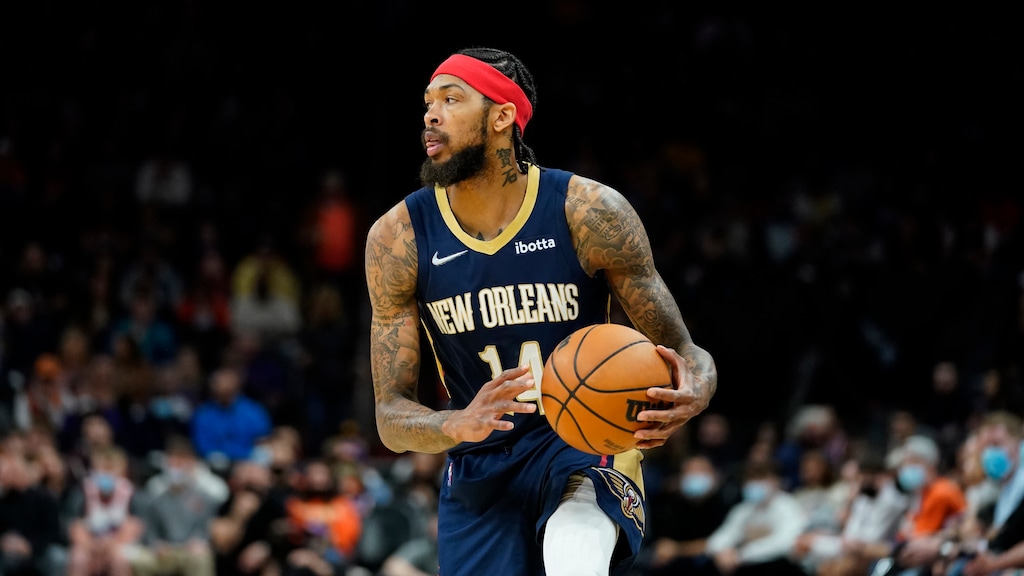 New Orleans Pelicans forward Brandon Ingram (14) drives against the Phoenix Suns during the first half of an NBA basketball game, Friday, Feb. 25, 2022, in Phoenix. (AP Photo/Matt York)