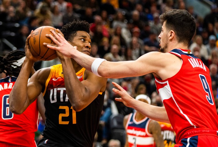 (Rick Egan | The Salt Lake Tribune) Utah Jazz center Hassan Whiteside (21) looks to pass as Washington Wizards forward Deni Avdija (9) defends, as Utah Jazz guard Donovan Mitchell (45) and Utah Jazz center Rudy Gobert (27) defend, in NBA action between the Utah Jazz and the Washington Wizards, at Vivint Arena on Saturday, Dec. 18, 2021.