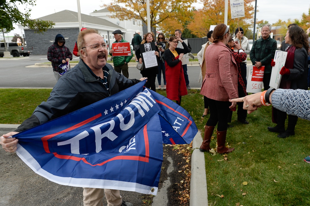 (Francisco Kjolseth | The Salt Lake Tribune)  Kevin Howard argues with supporters of the impeachment inquiry as two competing rallies spar near Rep. Ben McAdams' office in West Jordan, one seeking to support McAdams and one to criticize him for supporting the impeachment inquiry of President Donald Trump on Wednesday, Oct. 9, 2019.