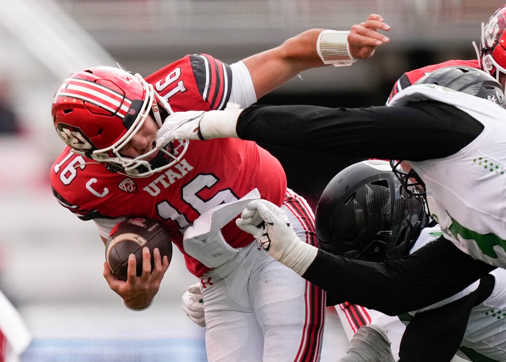 (Francisco Kjolseth  |  The Salt Lake Tribune) Utah Utes quarterback Bryson Barnes (16) is taken down as the Utah Utes host the Oregon Ducks, NCAA football in Salt Lake City on Saturday, Oct. 28, 2023.