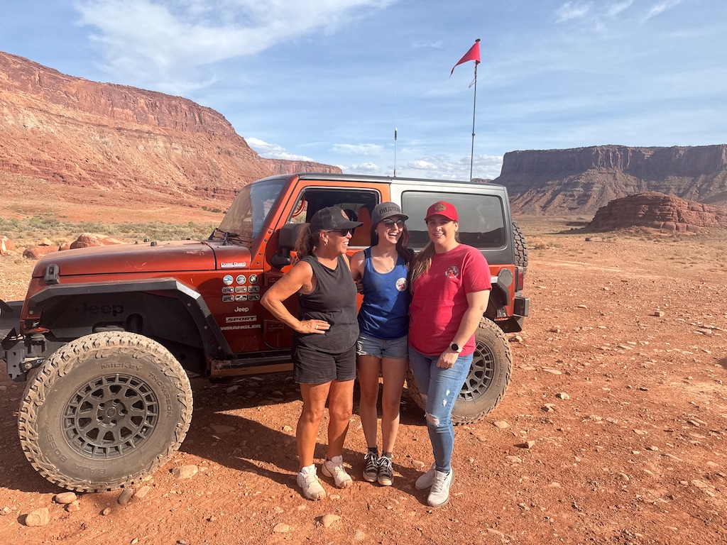 (Lizzie Ramirez | The Times-Independent) Bina Boles, Lyndsay Bryson and Brittany Tharp pose for a photo after their day of gunning for the first-timers package on Sunday, March 29.