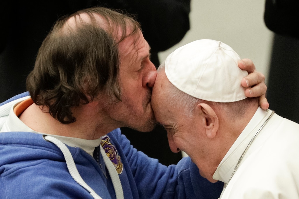 (Andrew Medichini | The Associated Press) Pope Francis is kissed by a man during his weekly general audience at the Pope Paul VI Hall at the Vatican, Wednesday, Feb. 19, 2020.