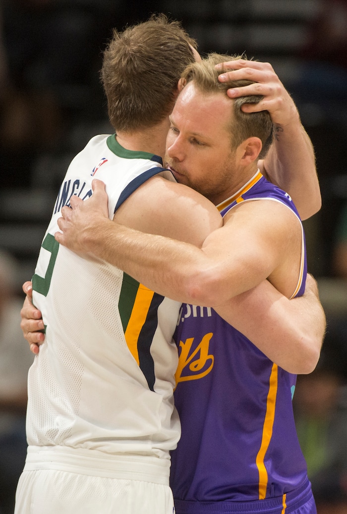 (Rick Egan  |  The Salt Lake Tribune)  Utah Jazz forward Joe Ingles (2) hugs fellow Australian Sydney Kings forward Brad Newley (8), before the preseason game vs.Sydney Kings, in Salt Lake City, Sunday, October 2, 2017.



