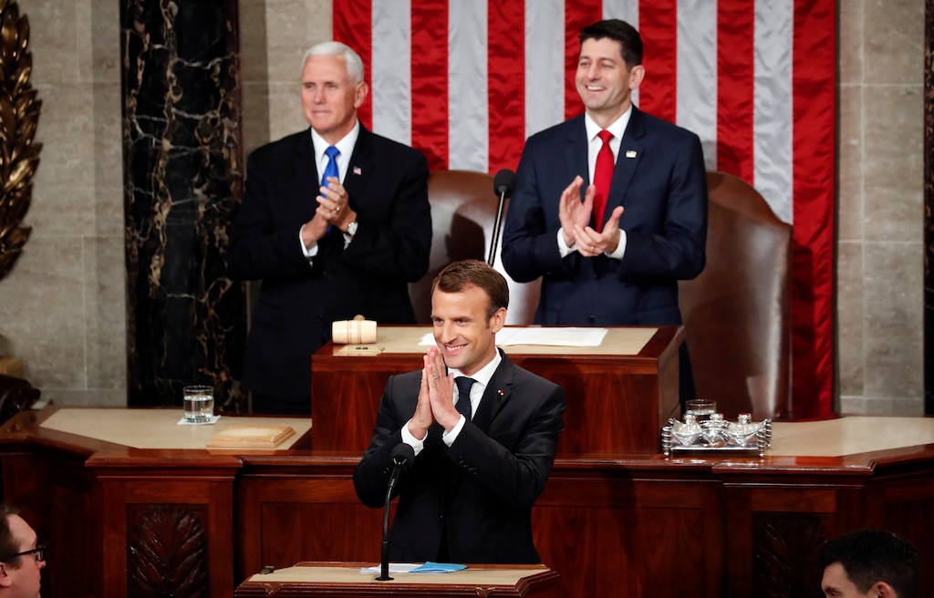 (Pablo Martinez Monsivais | The Associated Press) French President Emmanuel Macron gestures as he is introduced before speaking to a joint meeting of Congress on Capitol Hill in Washington, Wednesday, April 25, 2018. Standing behind him are Vice President Mike Pence and House Speaker Paul Ryan of Wis.