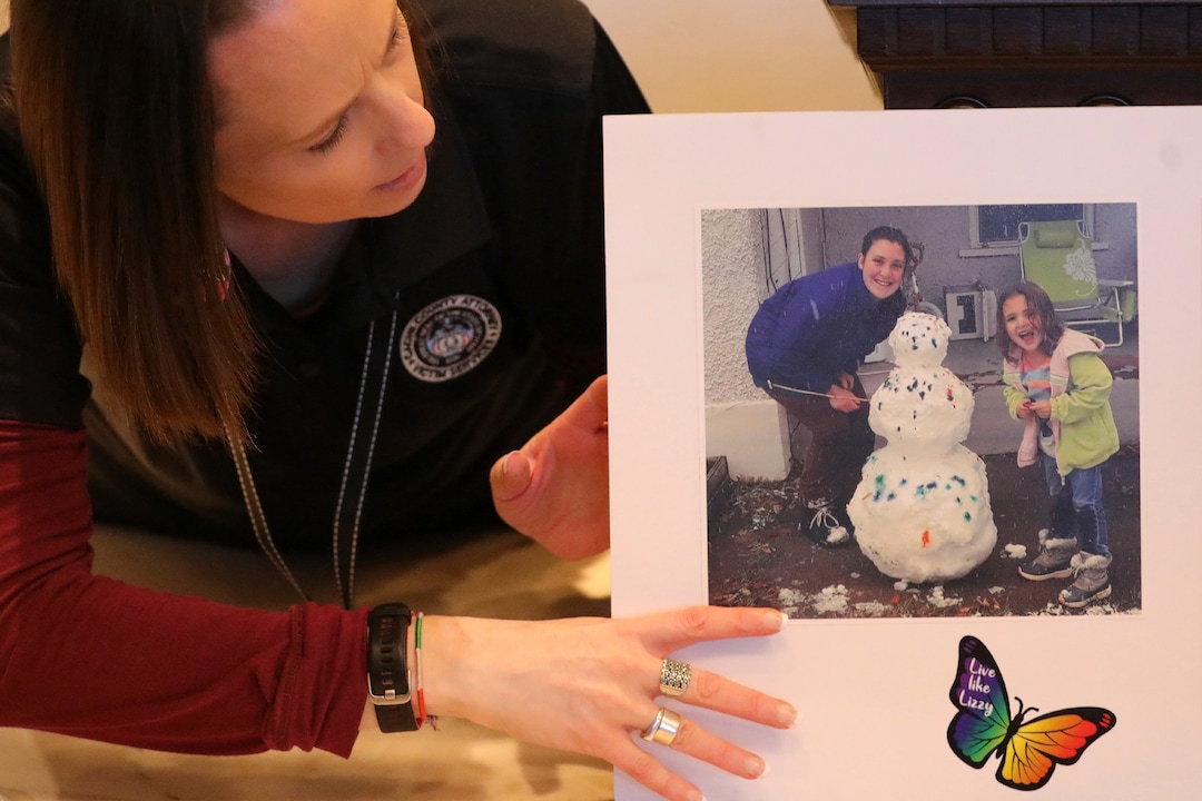 Victim advocate Kandace McCreary, left, displays a photo Elizabeth "Lizzy" Shelley before her mother Jessica Black, spoke with reporters following the sentencing for Alex Whipple Tuesday, Sept. 24, 2019, in Logan, Utah. Whipple, a Utah man who pleaded guilty to killing his 5-year-old niece has been sentenced to life in prison with no chance of parole. The girl's relatives called him a "monster" during an emotional hearing. (AP Photo/Rick Bowmer)