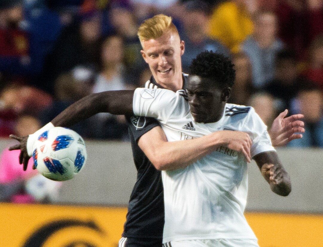 (Rick Egan  |  The Salt Lake Tribune) Real Salt Lake defender Justen Glad (15) goes for the ball along with Colorado Rapids forward Dominique Badji (14), in MLS soccer action, between Real Salt Lake and Colorado Rapids,  at Rio Tinto Stadium, Saturday, April 21, 2018.