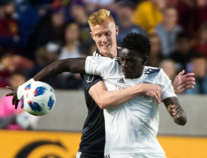 (Rick Egan  |  The Salt Lake Tribune) Real Salt Lake defender Justen Glad (15) goes for the ball along with Colorado Rapids forward Dominique Badji (14), in MLS soccer action, between Real Salt Lake and Colorado Rapids,  at Rio Tinto Stadium, Saturday, April 21, 2018.


