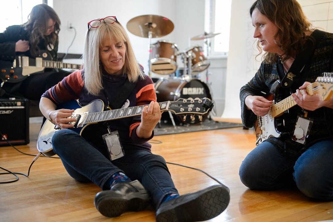 (Trent Nelson | The Salt Lake Tribune)  Caroline Gaudy and Susan Reimers practice guitar at Rock Camp for Womyn.