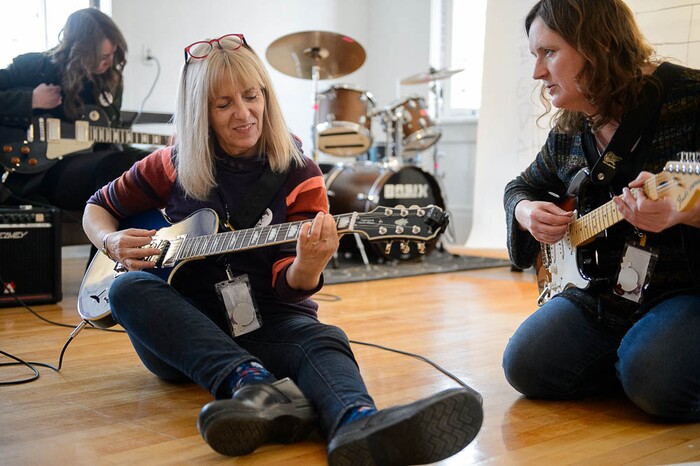 (Trent Nelson | The Salt Lake Tribune) Caroline Gaudy and Susan Reimers practice guitar at Rock Camp for Womyn.