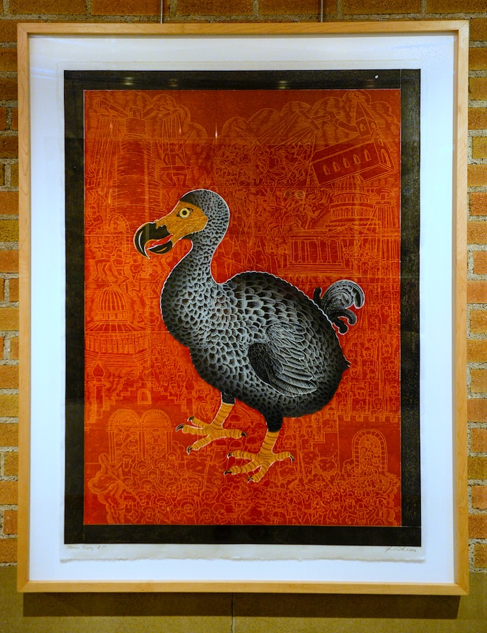 Leah Hogsten  |  The Salt Lake Tribune  "Phoenix Rising," by John Buck, Bozeman, Montana, woodcut print, 2006
Tuesday, June 12, 2018 at the exhibit, "Speaking Volumes: Transforming Hate," opening Friday, June 15 at the Ogden Union Station Museum. The exhibit showcases 30 artists who transformed white-supremacist books into uplifting works of art.