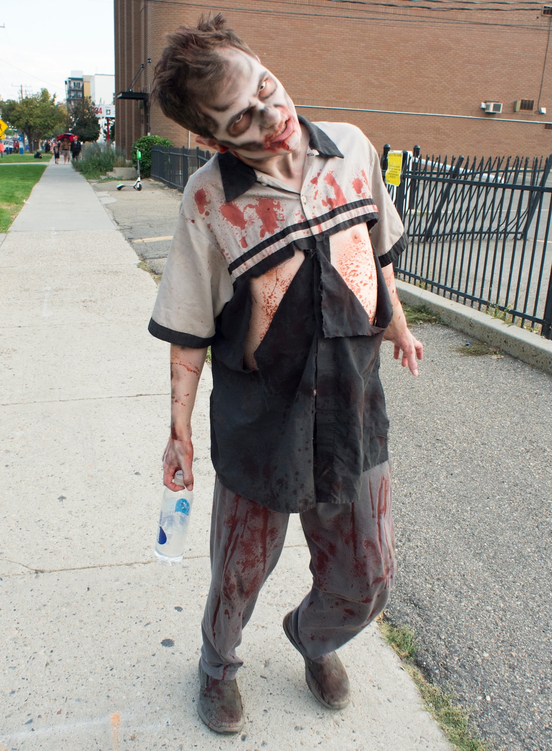  (Rick Egan  |  The Salt Lake Tribune)       Derek Green walks down 200 South as a zombie during the 11th annual Salt Lake Zombie Walk, Sunday, Aug. 26, 2018.