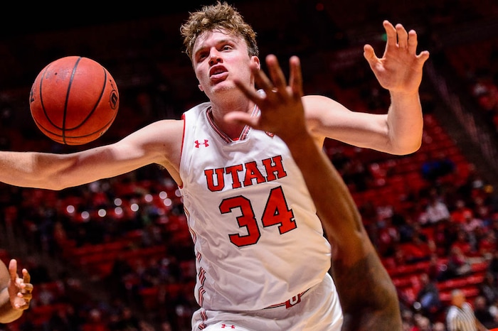 (Trent Nelson | The Salt Lake Tribune)  Utah Utes forward Jayce Johnson (34) and a loose ball as the University of Utah hosts Northwestern State, NCAA basketball in Salt Lake City, Wednesday December 20, 2017.
