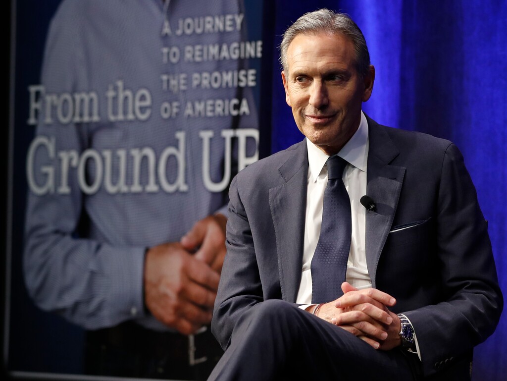 FILE- In this Monday, Jan. 28, 2019, file photo former Starbucks CEO and Chairman Howard Schultz looks out at the audience during a book promotion tour in New York. Schultz spent more than 30 years at Starbucks, growing a handful of coffee shops into a much-admired global brand. But now, as the billionaire mulls running for president as an independent, Starbucks will have to tread carefully.(AP Photo/Kathy Willens, File)