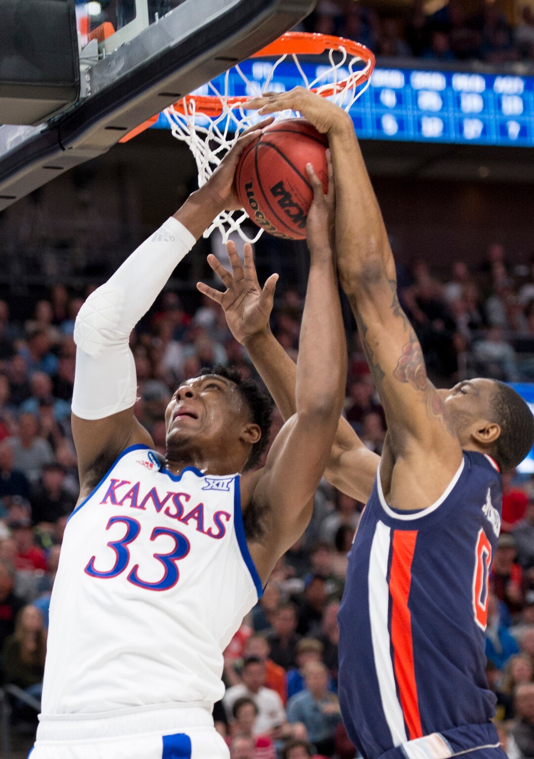 (Leah Hogsten  | The Salt Lake Tribune)  Auburn Tigers forward Horace Spencer (0) blocks Kansas Jayhawks forward David McCormack (33) as Auburn faces Kansas in the second round of the NCAA tournament in Salt Lake City on Saturday, March 23, 2019.