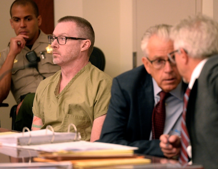 (Al Hartmann  |  The Salt Lake Tribune)       
Craig Crawford, left, sits with defense lawyers Jim Bradshaw and Mark Moffat in 3rd District Judge James Blanch's courtroom during a three-day sentencing hearing Monday August 28 in Salt Lake City.  Crawford has admitted that he trapped his 72-year-old estranged husband, well-known restaurateur John Williams, inside his home and then set it ablaze last year.
He pleaded guilty in June to first-degree felony counts of aggravated murder and aggravated arson.
The judge will decide whether Crawford will serve life in prison with or without the possibility of parole.