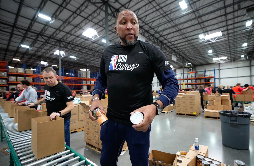 (Francisco Kjolseth | The Salt Lake Tribune) Former NBA player Shawn Marion helps pack boxes with food during the NBA Cares Day of Service in Salt Lake City on Feb. 17, 2023.