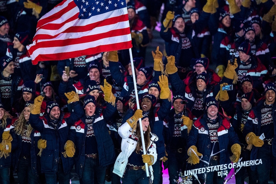 (Chris Detrick  |  The Salt Lake Tribune)  U.S. luger Erin Hamlin carries the American flag during the Pyeongchang 2018 Winter Olympics opening ceremony at Olympic Stadium Friday, February 9, 2018.  