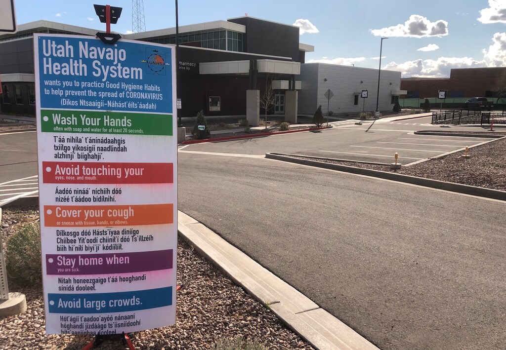 (Zak Podmore | Tribune file photo) This March 20, 2020, file photo shows a coronavirus sign outside the Montezuma Creek Clinic on the northern Navajo Nation. As of Monday, there have been 59 COVID-19 deaths on the Navajo Nation.