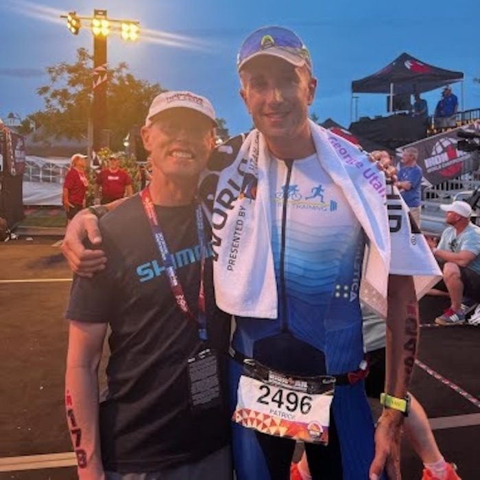 Colleen Brown/contributed
Kyle Brown of Kaysville, left, greets Patrick Harfield of the Caymen Islands at the finish line of the 2021 Ironman World Championships in St. George on Saturday, May 7, 2022. Brown, who has Lou Gehrig's Disease, and was pulled from the race after the swim convinced Harfield to finish the race after Harfield collapsed during the run.
