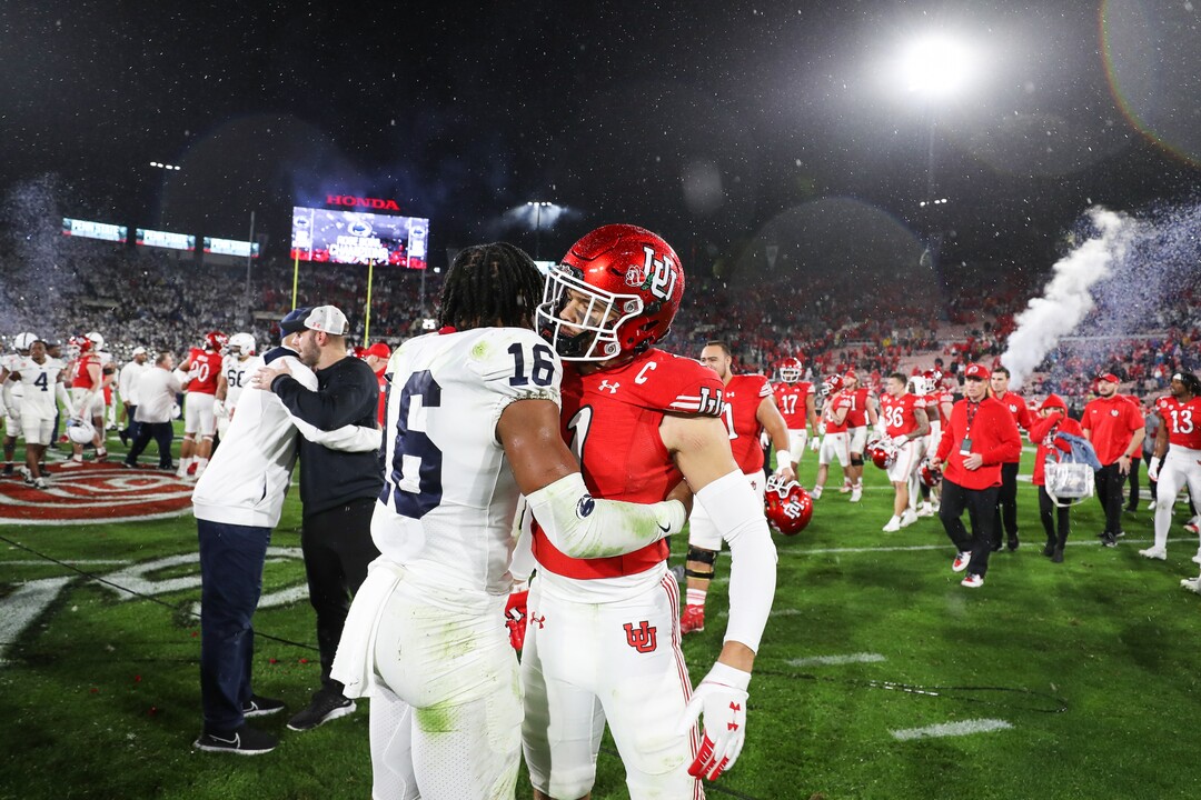 (Meg Oliphant | Special to The Tribune) Penn State’s Ji'Ayir Brown (16) embraces Utah safety R.J. Hubert (11) after the game at Rose Bowl Stadium on Jan. 2, 2023 in Pasadena, California.