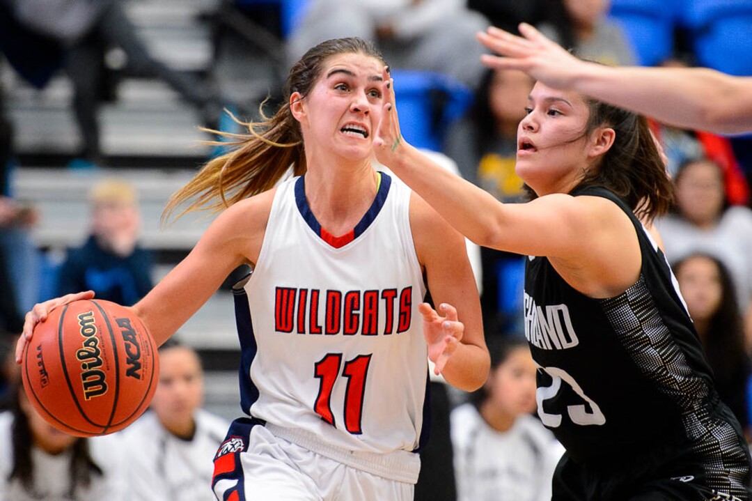 (Trent Nelson | The Salt Lake Tribune)  Woods Cross's Olivia Barton (11) defended by Highland's Taryn Johnson (23) as Woods Cross faces Highland in the 5A High School Girls' Basketball Tournament at SLCC in Taylorsville, Wednesday Feb. 21, 2018.