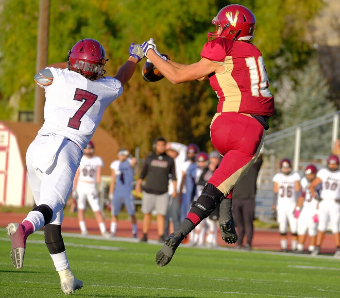 (Leah Hogsten  |  The Salt Lake Tribune) Jordan's Hunter Swapp knocks away the pass intended for Viewmont's Cole Salmon. Jordan High School boys' football team defeated Viewmont High School 28-20 during their class 5A football playoff opener, Friday, October 27, 2017 in Bountiful.