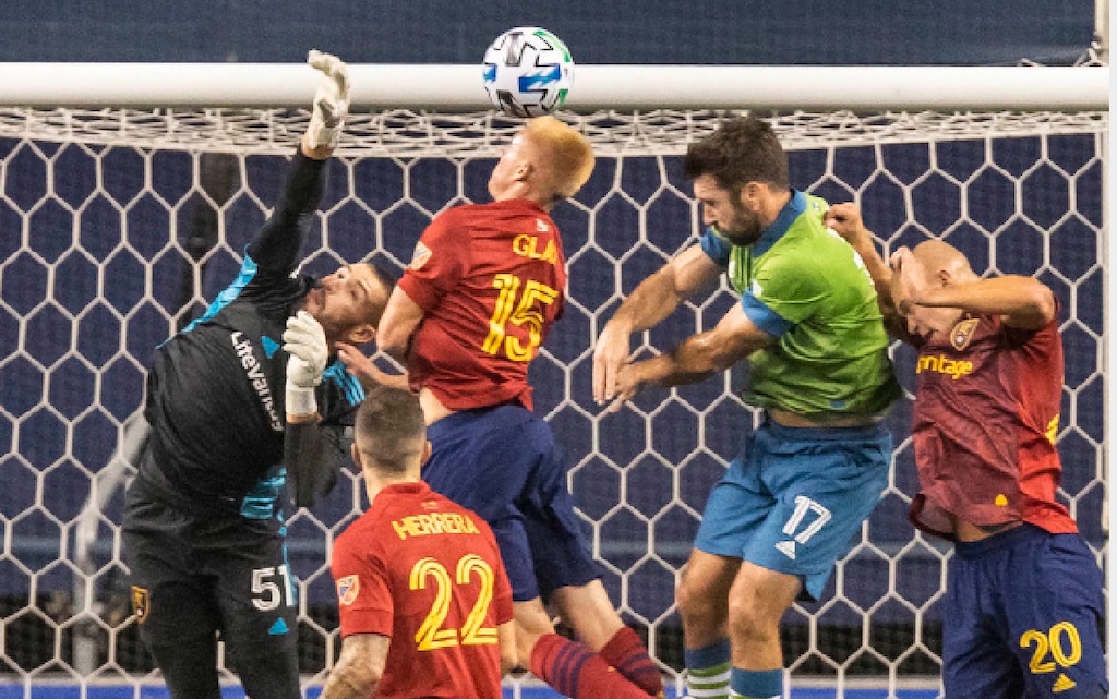 Real Salt Lake goalkeeper Andrew Putna rejects the corner intended for Seattle Sounders' Will Bruin in front of the goaliduring the first half of an MLS soccer match Wednesday, Oct. 7, 2020, in Seattle. (Dean Rutz/The Seattle Times via AP)