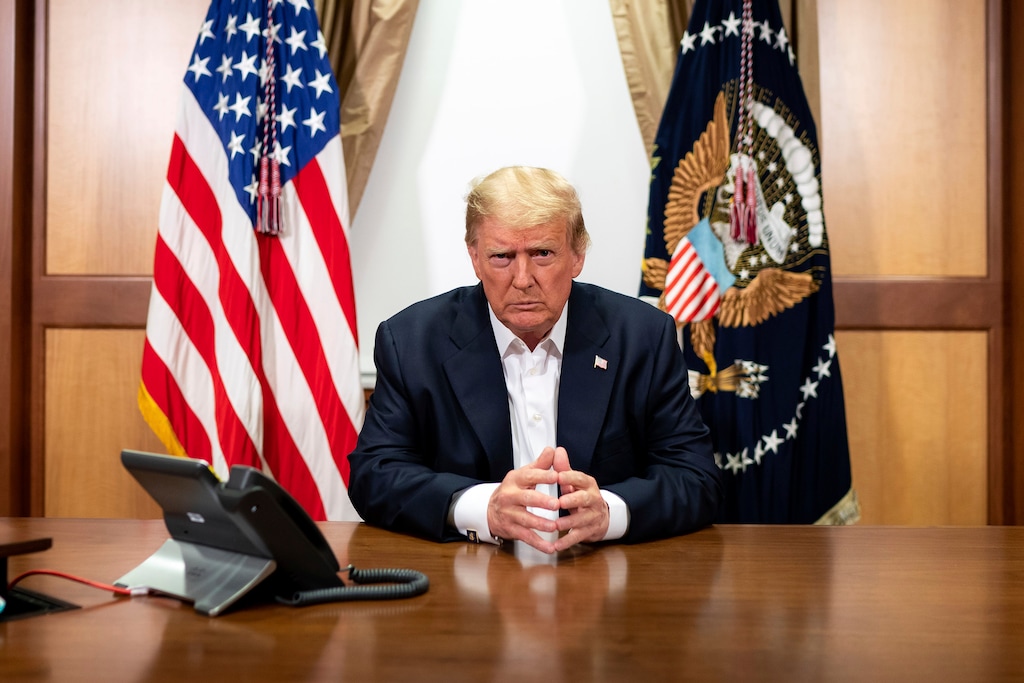 (Tia Dufour | The White House via AP) In this image provided by the White House, President Donald Trump in his conference room at Walter Reed National Military Medical Center in Bethesda, Md., Sunday, Oct. 4, 2020.