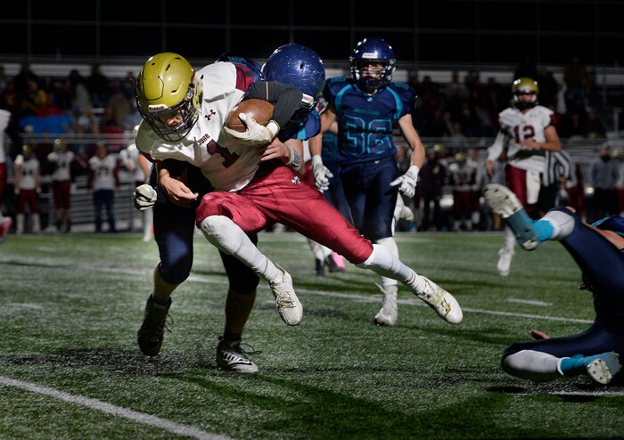 (Scott Sommerdorf   |  The Salt Lake Tribune)   Juab Macray Stevens leaps for yardage during second half play. Juan Diego beat Juab 33-28, Friday, October 6, 2017. 
