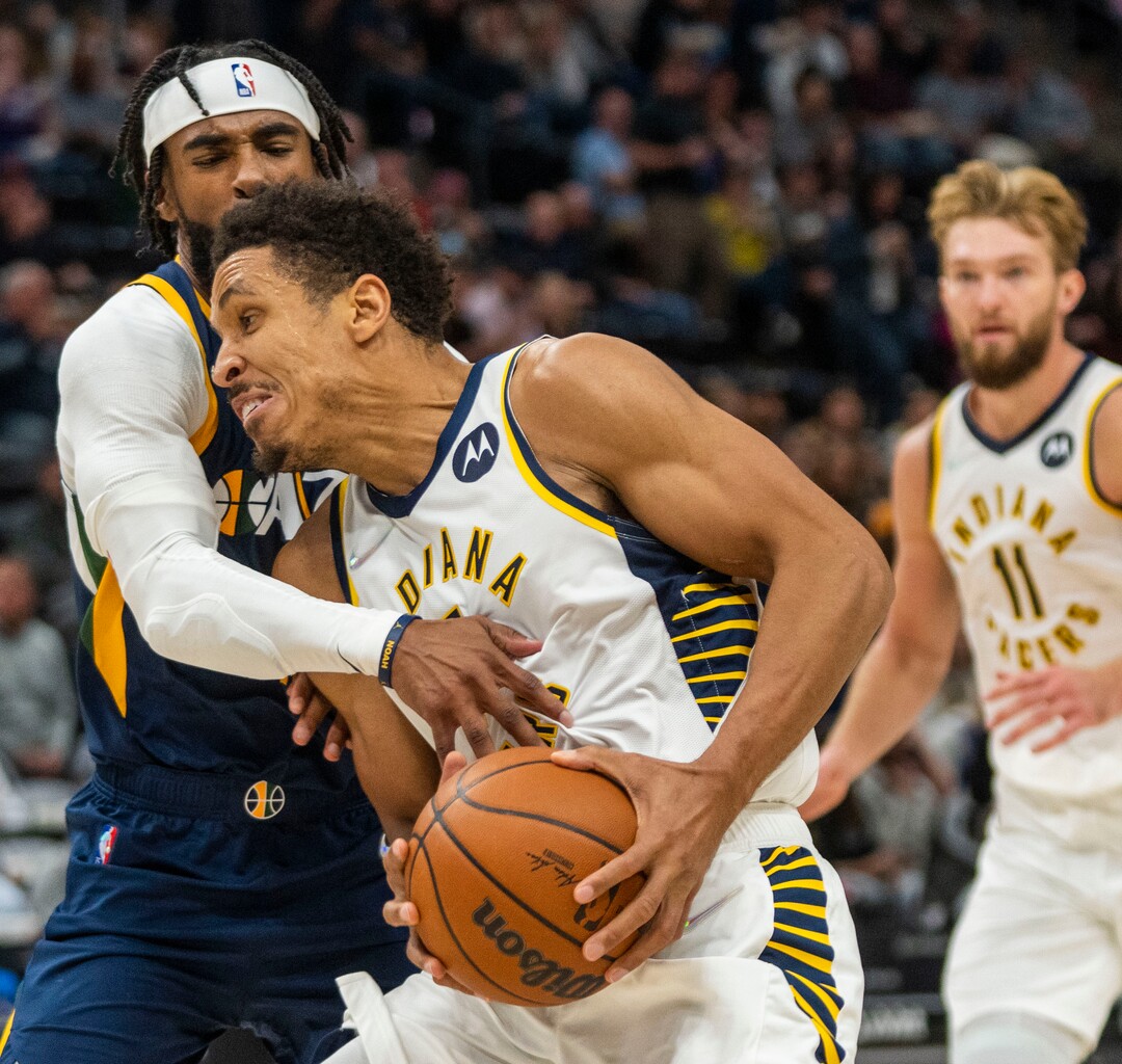 (Rick Egan | The Salt Lake Tribune) Utah Jazz guard Jordan Clarkson (00)tries to stop Indiana Pacers guard Malcolm Brogdon (7), as he takes the ball to the hoop, in NBA action between the Utah Jazz and the Indiana Pacers at Vivint Arena, on Thursday, Nov. 11, 2021.