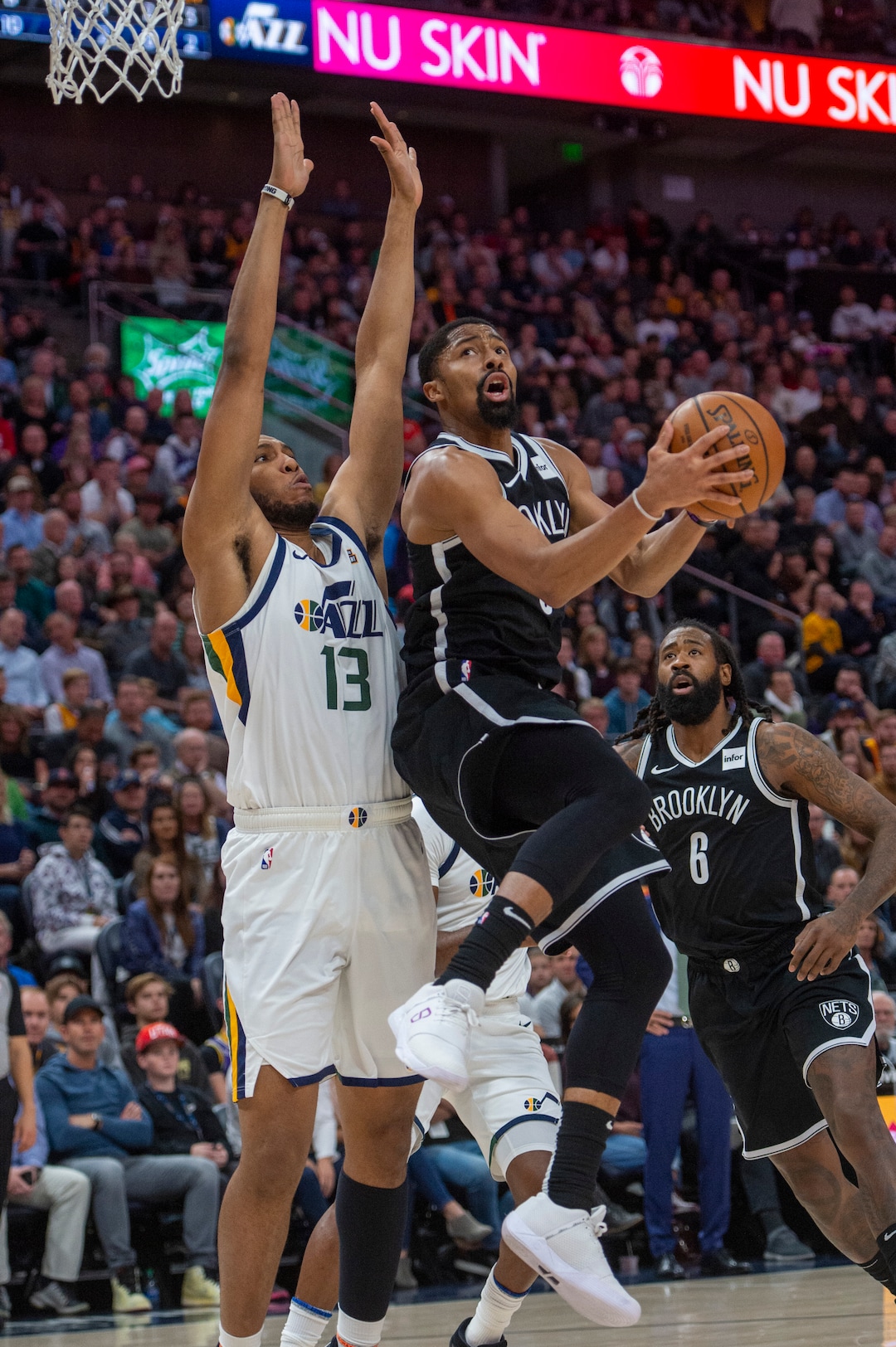 (Rick Egan  |  The Salt Lake Tribune)        Brooklyn Nets guard Spencer Dinwiddie (8) goes to the hoop, as Utah Jazz center Tony Bradley (13) defends, in NBA basketball action between the Utah Jazz and the Brooklyn Nets in Salt Lake City, Tuesday, Nov 12, 2019.
