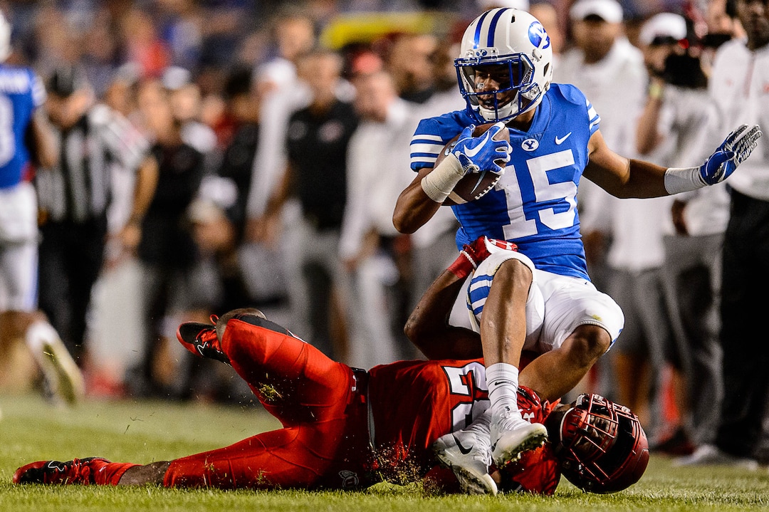 (Trent Nelson | The Salt Lake Tribune)  Utah Utes defensive back Javelin Guidry (28) brings down Brigham Young Cougars wide receiver Aleva Hifo (15) as BYU hosts Utah, NCAA football in Provo, Saturday September 9, 2017.