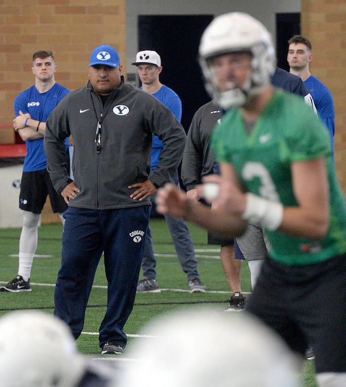 (Al Hartmann | The Salt Lake Tribune)
BYU opened spring football camp on Monday March 5 in the indoor playing facility. Head Coach Kalani Sitake watches quarterback Kody Wilstead takes his turn running the offense.