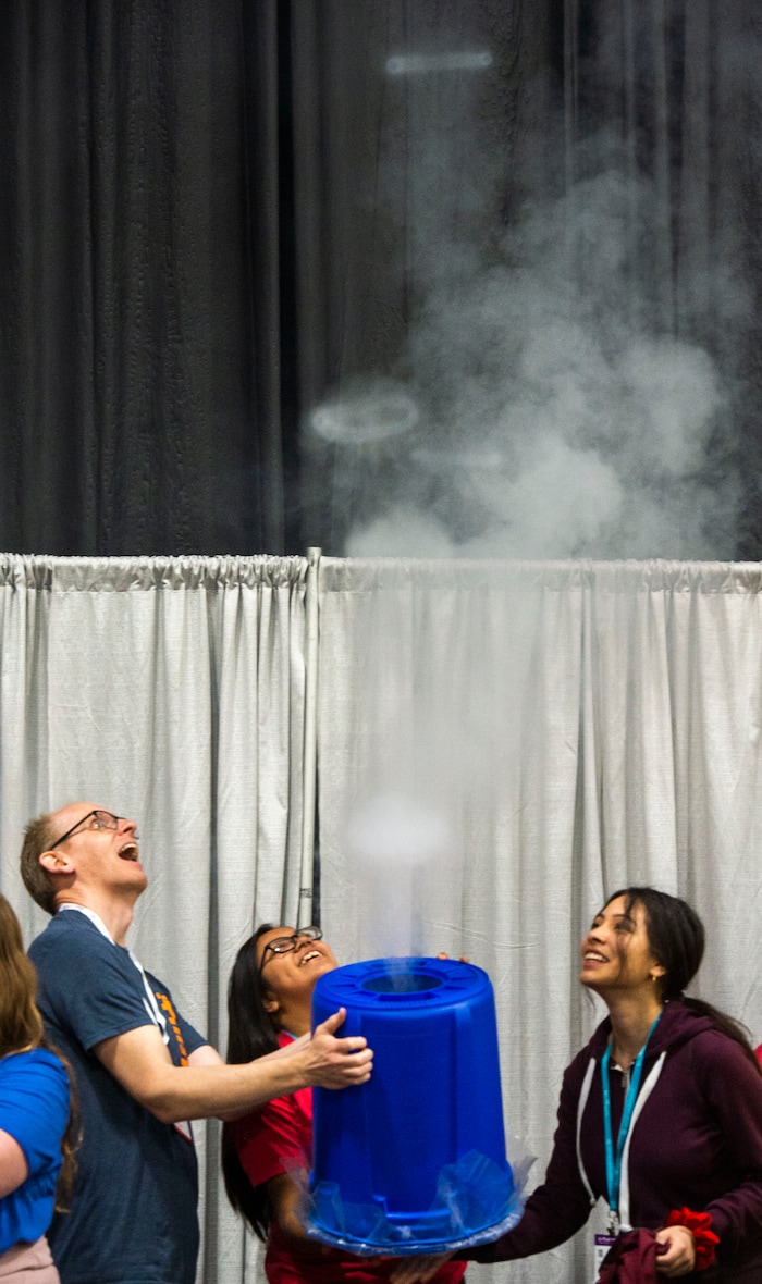 (Rick Egan  |  The Salt Lake Tribune)         Participants make smoke rings at one of the exhibits during the SheTech Explorer Day event, at the Mountain America Expo Center in Sandy, Tuesday, April 9, 2019.