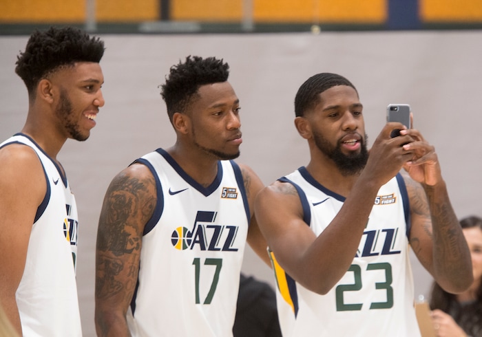(Rick Egan  |  The Salt Lake Tribune) Utah Jazz center Tony Bradley, Eric Griffin, and Royce O'Neale, check out something on a phone, during the Utah Jazz media day, at the Zions Bank Basketball Center, Monday, September 25, 2017.


