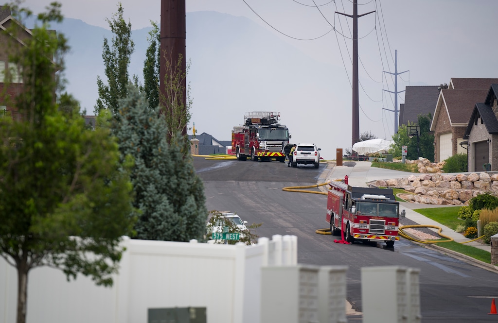 (Bethany Baker  |  The Salt Lake Tribune) Crews respond to a fire in Washington Terrace on Monday, July 27, 2026.