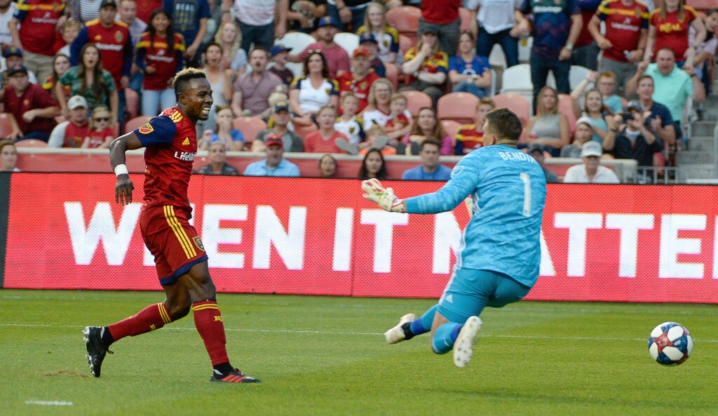 Real Salt Lake forward Sam Johnson (50) scores on Columbus Crew goalkeeper Joseph Bendik during an MLS soccer match Wednesday, July 3, 2019, in Sandy, Utah. (Francisco Kjolseth/The Salt Lake Tribune via AP)