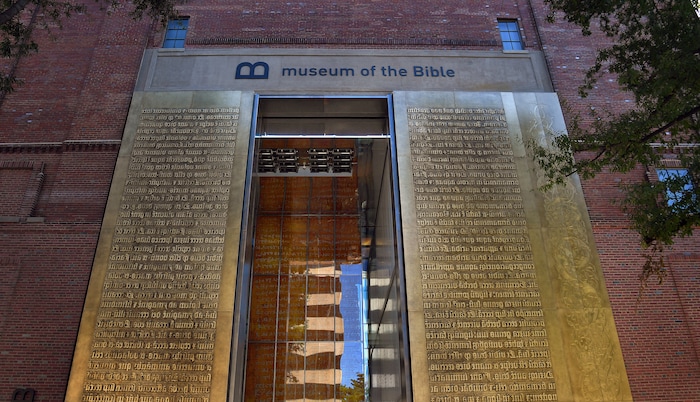 The entrance to the Museum of the Bible features relief metal lettering of scriptures in Latin. MUST CREDIT: Washington Post photo by Michael S. Williamson.