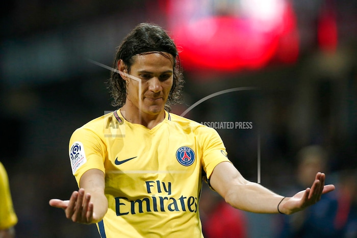 PSG's Roberto Edison Cavani celebrates his side's 2nd goal during the French League One soccer match between Guingamp and PSG at the Roudourou stadium in Guingamp, western France, Sunday, Aug. 13, 2017. Neymar makes his long-awaited debut with Paris Saint-Germain on Sunday in the small Brittany town of Guingamp. (AP Photo/Kamil Zihnioglu)