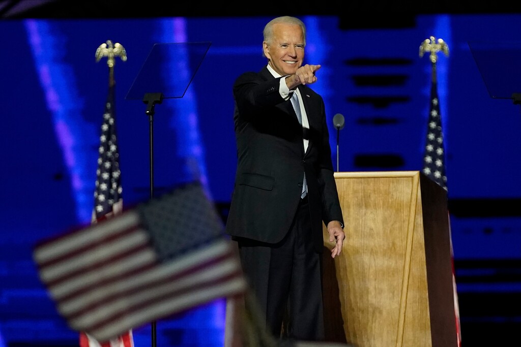 (Andrew Harnik | AP pool photo) President-elect Joe Biden gestures on stage after speaking, Saturday, Nov. 7, 2020, in Wilmington, Del.