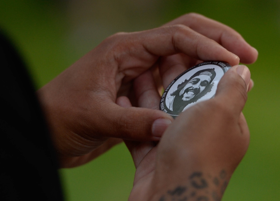 Rae Duckworth looks at an image of her cousin, Bobby Duckworth, who was killed by a police officer in 2019.