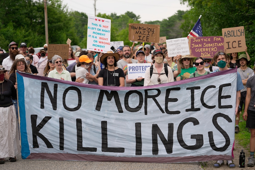 Protesters gather near a U.S. Immigration and Customs Enforcement facility Scarborough, Maine, one day after the shooting of Johan Sebastián Durán Guerrero, Tuesday, July 14, 2026. (AP Photo/Robert F. Bukaty)