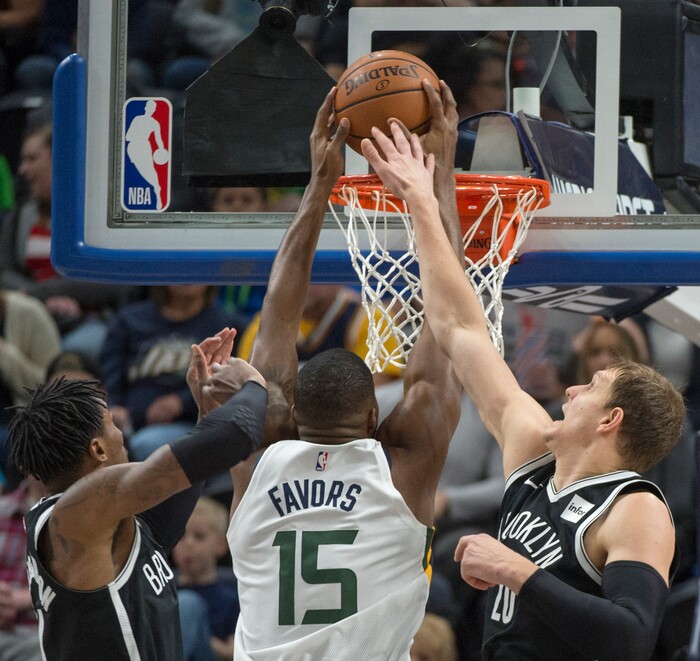 (Rick Egan  |  The Salt Lake Tribune)  Utah Jazz forward Derrick Favors (15) dunks the ball over Brooklyn Nets forward Rondae Hollis-Jefferson (24) and Brooklyn Nets center Timofey Mozgov (20), in NBA action, Utah Jazz vs. Brooklyn Nets, in Salt Lake City, Saturday, November 11, 2017.