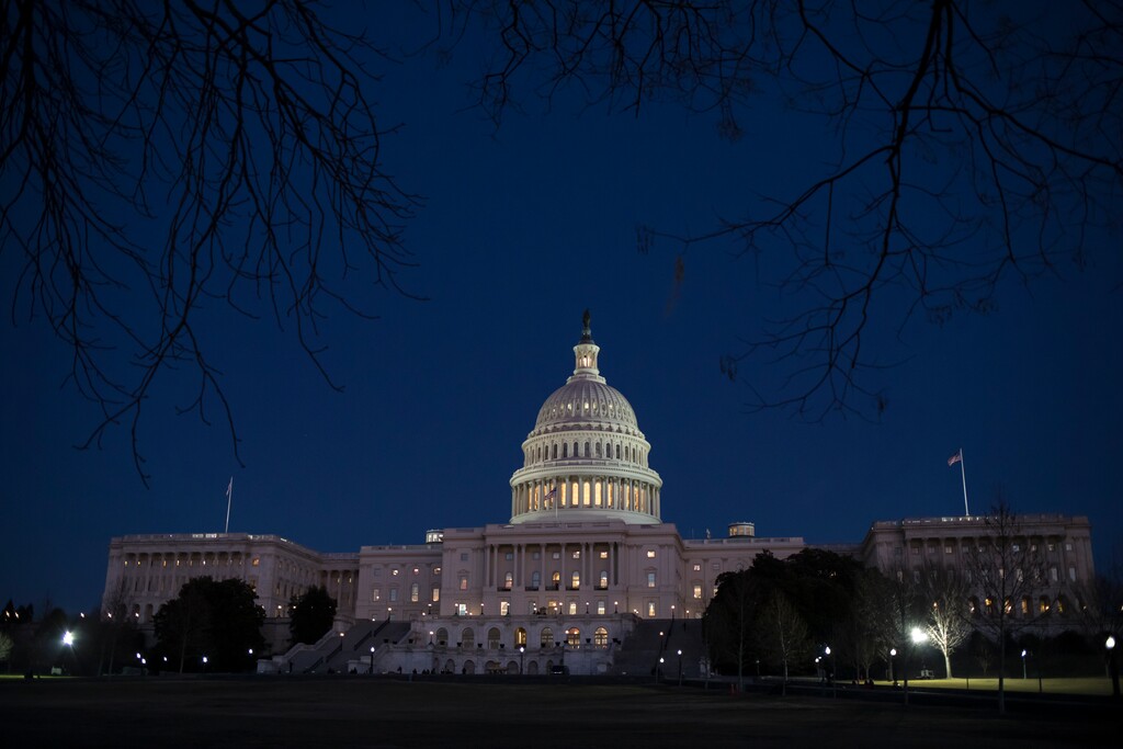 With no apparent indications of a breakthrough in the Senate to avoid a government shutdown, the Capitol is illuminated in Washington, Friday evening, Jan. 19, 2018. (AP Photo/J. Scott Applewhite)
